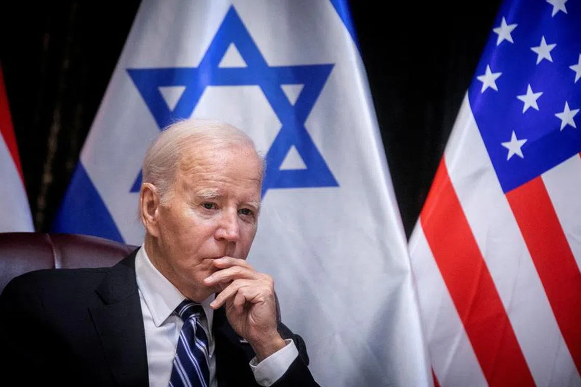 U.S. President Joe Biden pauses during a meeting with Israeli Prime Minister Benjamin Netanyahu to discuss the ongoing conflict between Israel and Hamas, in Tel Aviv, Israel, Wednesday, Oct. 18, 2023.  Miriam Alster/Pool via REUTERS
