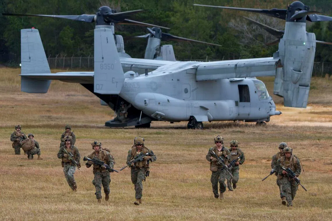 Members of a Marine Expeditionary Unit (MEU) disembarking from an MV-22B Osprey during training in Okinawa, Japan, in 2025.