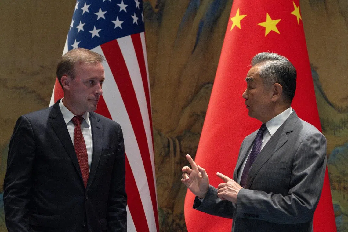 Wang Yi, the director of the Communist Party's Central Foreign Affairs Commission Office gestures near White House National Security Adviser Jake Sullivan before talks at Yanqi Lake in Beijing, China, August 27, 2024. Ng Han Guan/Pool via REUTERS