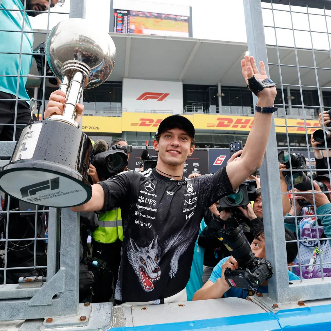 Formula One F1 - Japanese Grand Prix - Suzuka Circuit, Suzuka, Japan - March 29, 2026 Mercedes' Andrea Kimi Antonelli celebrates with the trophy after winning the Japanese Grand Prix REUTERS/Kim Kyung-Hoon