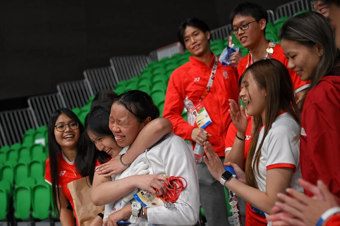 Kiria Tikanah celebrates with teammates after beating Kazakhstan’s Irina Bakaldina in the quarter-finals of the women’s individual epee event on Sept 22.
