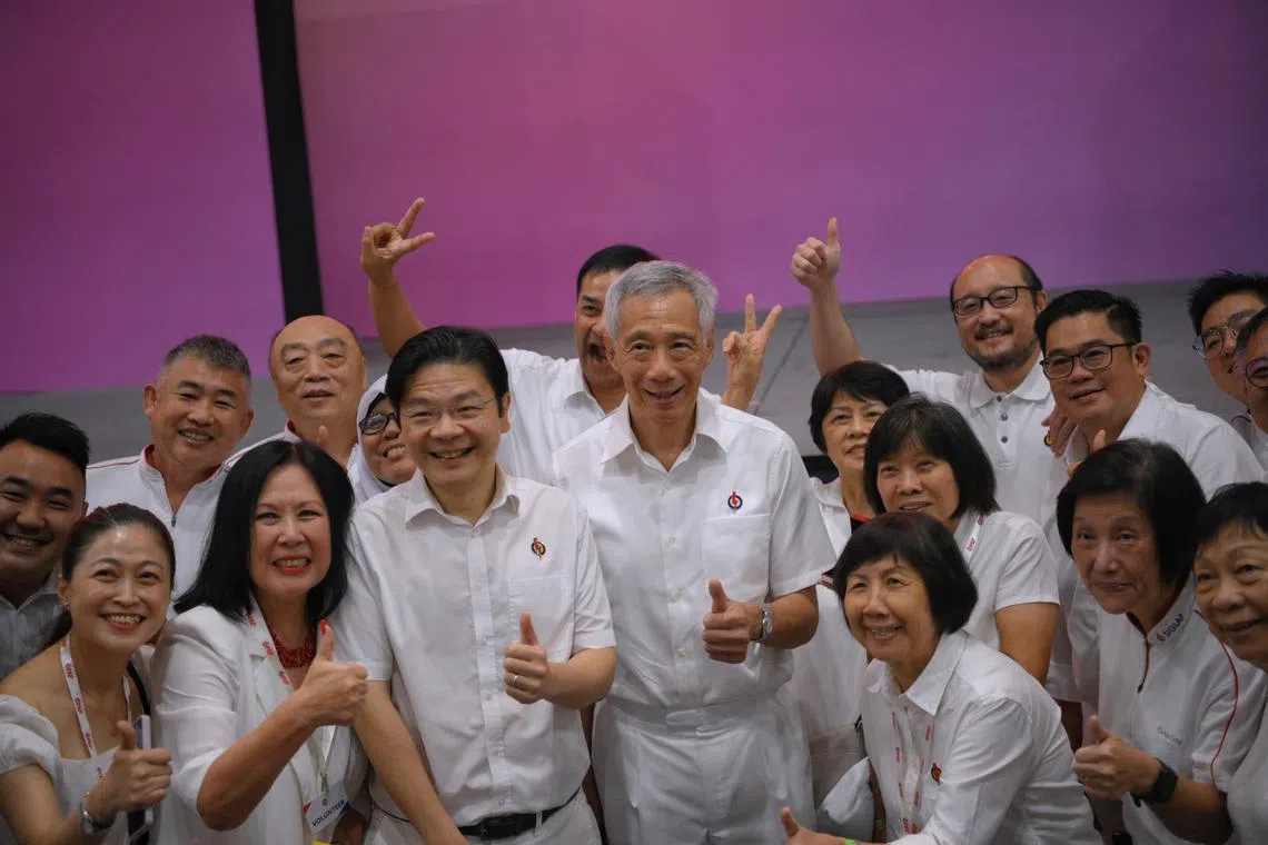PM Lee Hsien Loong and DPM Lawrence Wong mingling with party members after the PAP’s convention on Nov 5.
