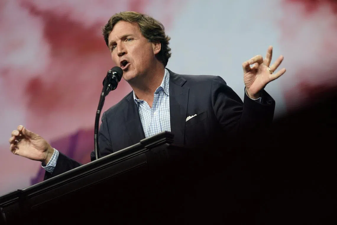 Tucker Carlson speaks at a campaign event for Republican presidential nominee and former U.S. President Donald Trump sponsored by conservative group Turning Point USA, in Duluth, Georgia, U.S., October 23, 2024. REUTERS/Elijah Nouvelage
