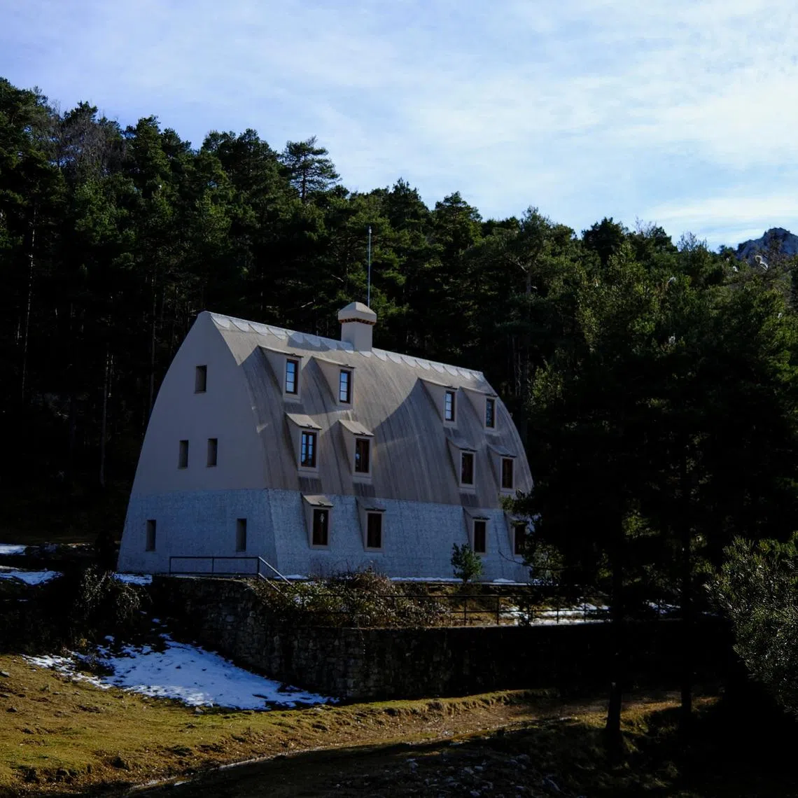 A visitor walks around of Xalet del Catllaras - a three-storey mountain shelter built for workers at a cement factory located 125 km (78 miles) north of Barcelona, Spain, February 18, 2026. REUTERS/Nacho Doce