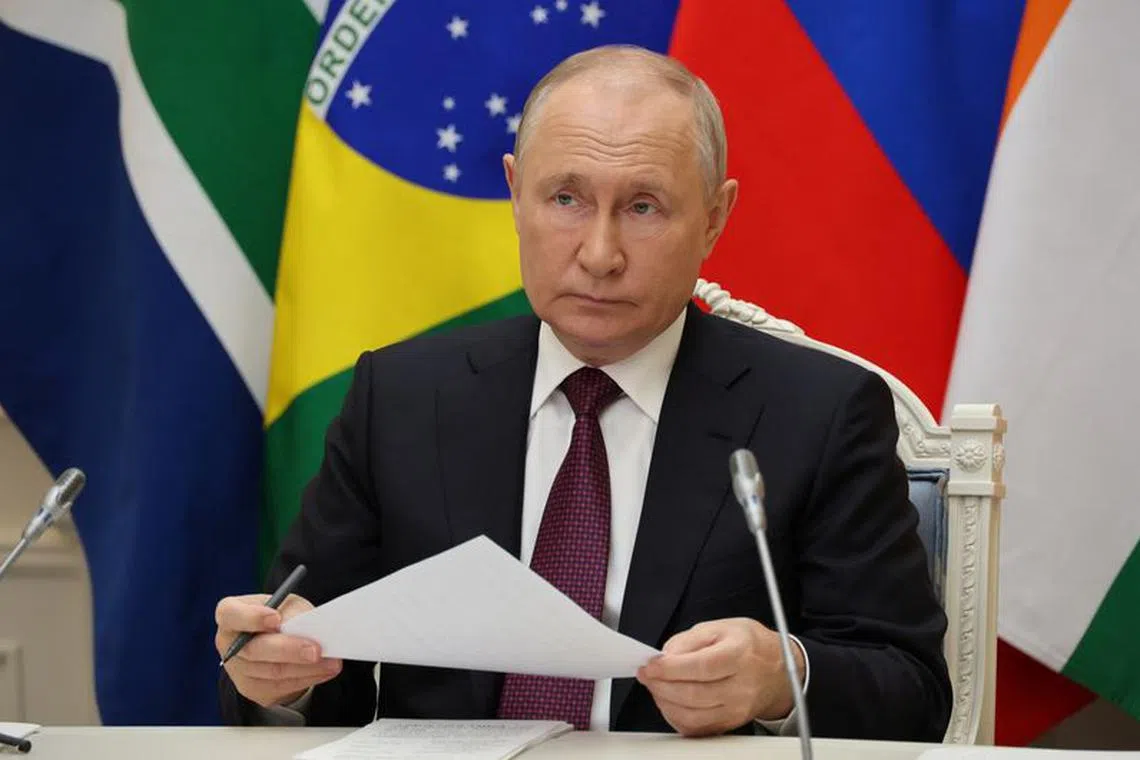 Russian President Vladimir Putin takes part in a press conference during the 15th BRICS Summit, via video link in Moscow, Russia, August 24, 2023. Sputnik/Mikhail Klimentyev/Kremlin via REUTERS
