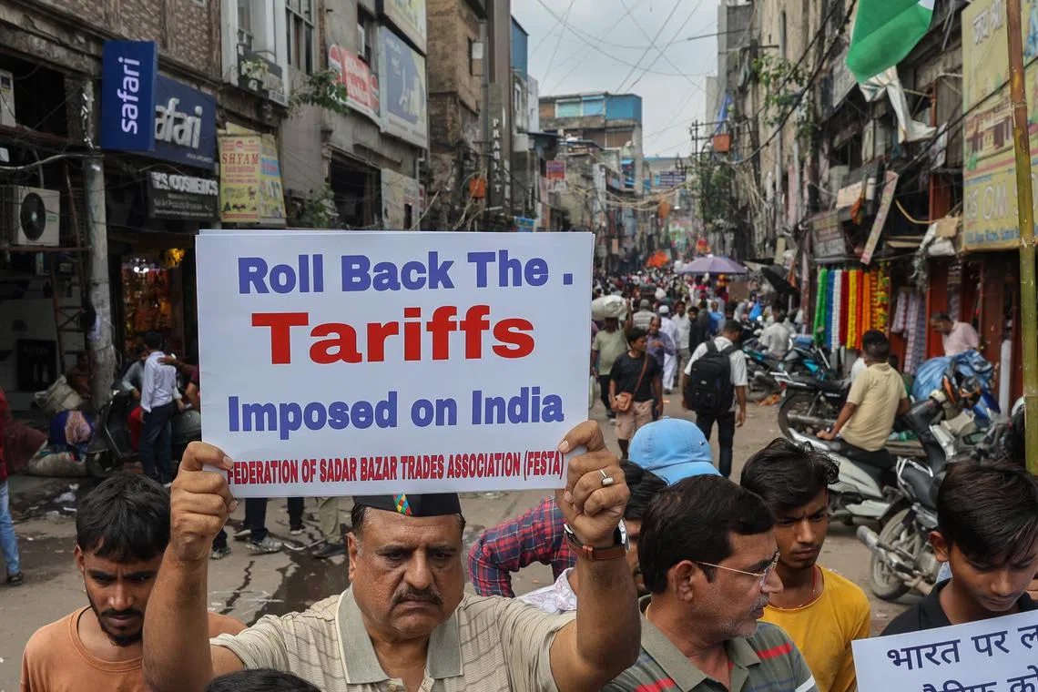 Members of the Federation of Sadar Bazar Trades Association protesting against US tariffs in New Delhi on Aug 30.
