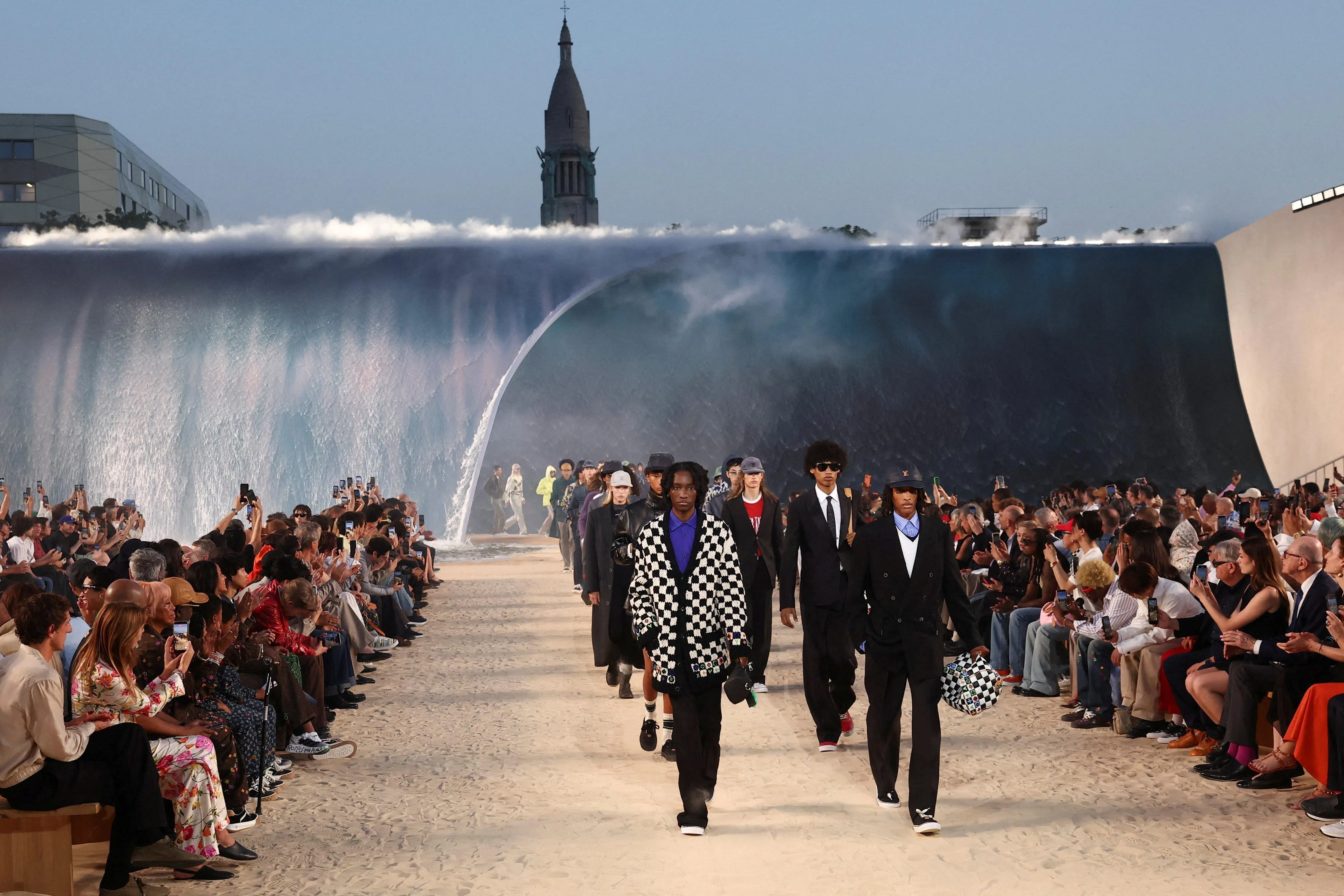 Models present creations by designer and musician Pharrell Williams as part of his Menswear Spring-Summer 2027 collection show for fashion house Louis Vuitton during Men's Fashion Week in Paris, France, June 23, 2026. REUTERS/Gonzalo Fuentes
 TPX IMAGES OF THE DAY