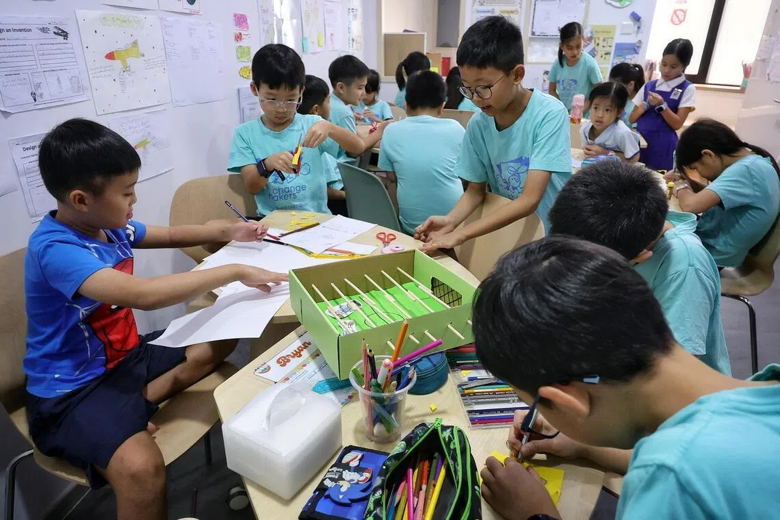 Pupils making a foosball table during the Young Innovators curriculum at Changemakers Afterschool.
