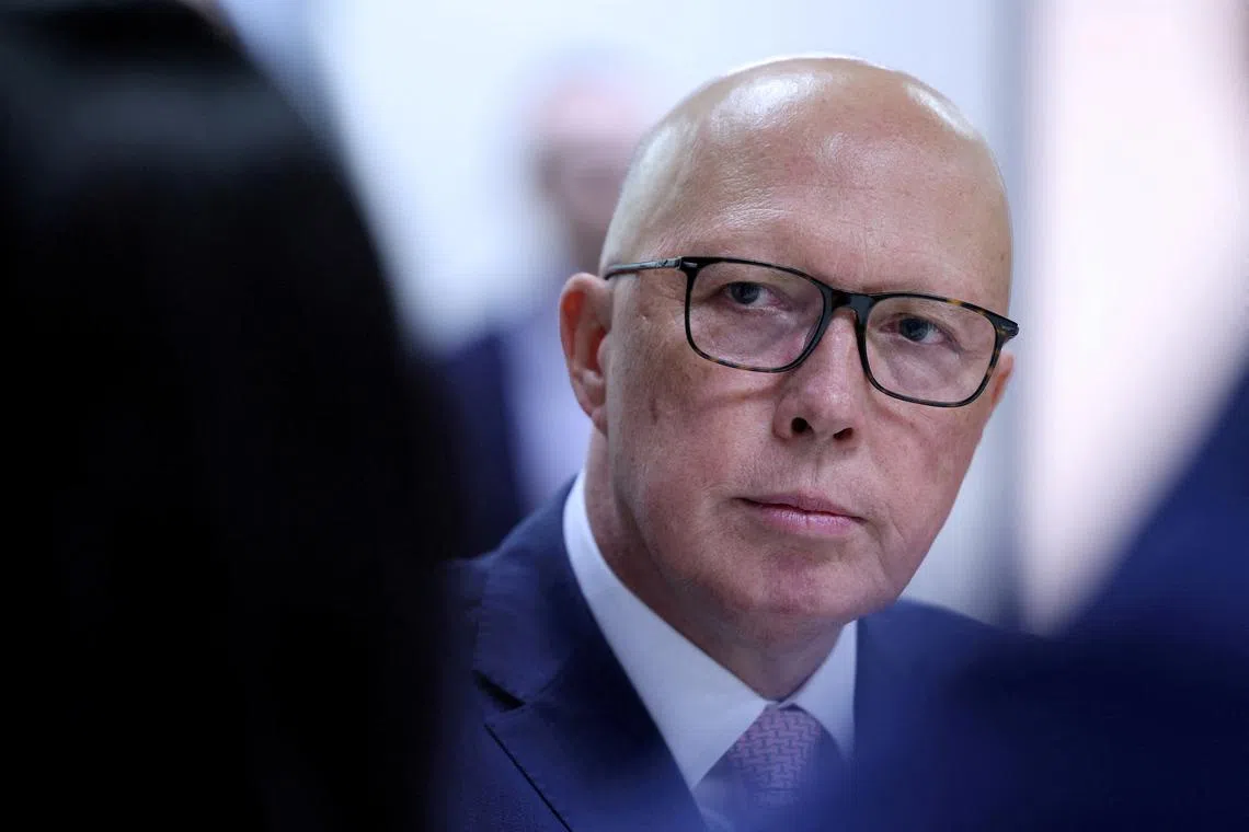 FILE PHOTO: Liberal Party leader Peter Dutton listens during a visit to youth mental health foundation, Headspace, in Parramatta, Western Sydney, Australia, March 23, 2025. REUTERS/Hollie Adams/File Photo