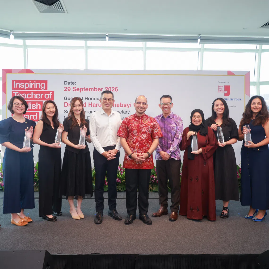 Senior Parliamentary Secretary for Education and National Development Syed Harun Alhabsyi (centre), flanked by ST editor Jaime Ho (in white shirt) and Speak Good English Movement chairman Jason Leow, with Inspiring Teacher of English Award recipients (from left) Benson Pang, Zheng Kankan, Wong Sui Lee, Lin Weijia Amanda, Rafidah Ridzuan, Chiu Yee Qian Millie, Sasha Kaur Dhillon and Foo Khim Youn Justina.