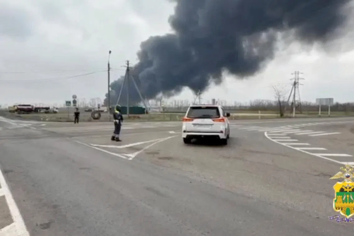Black smoke rises from the site of fire following an explosion at an oil depot, which was recently hit by a drone what local authorities called a Ukrainian a military strike, in the settlement of Kavkazskaya in the Krasnodar region, Russia, in this still image from video released March 21, 2025. Krasnodar Region's Ministry of Internal Affairs/Handout via REUTERS