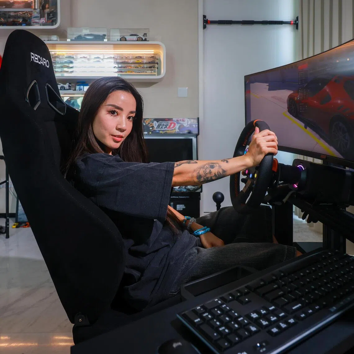 Content creator Naomi Neo’s favourite space in the house is her new “toy” – a $10,000 racing simulator.
