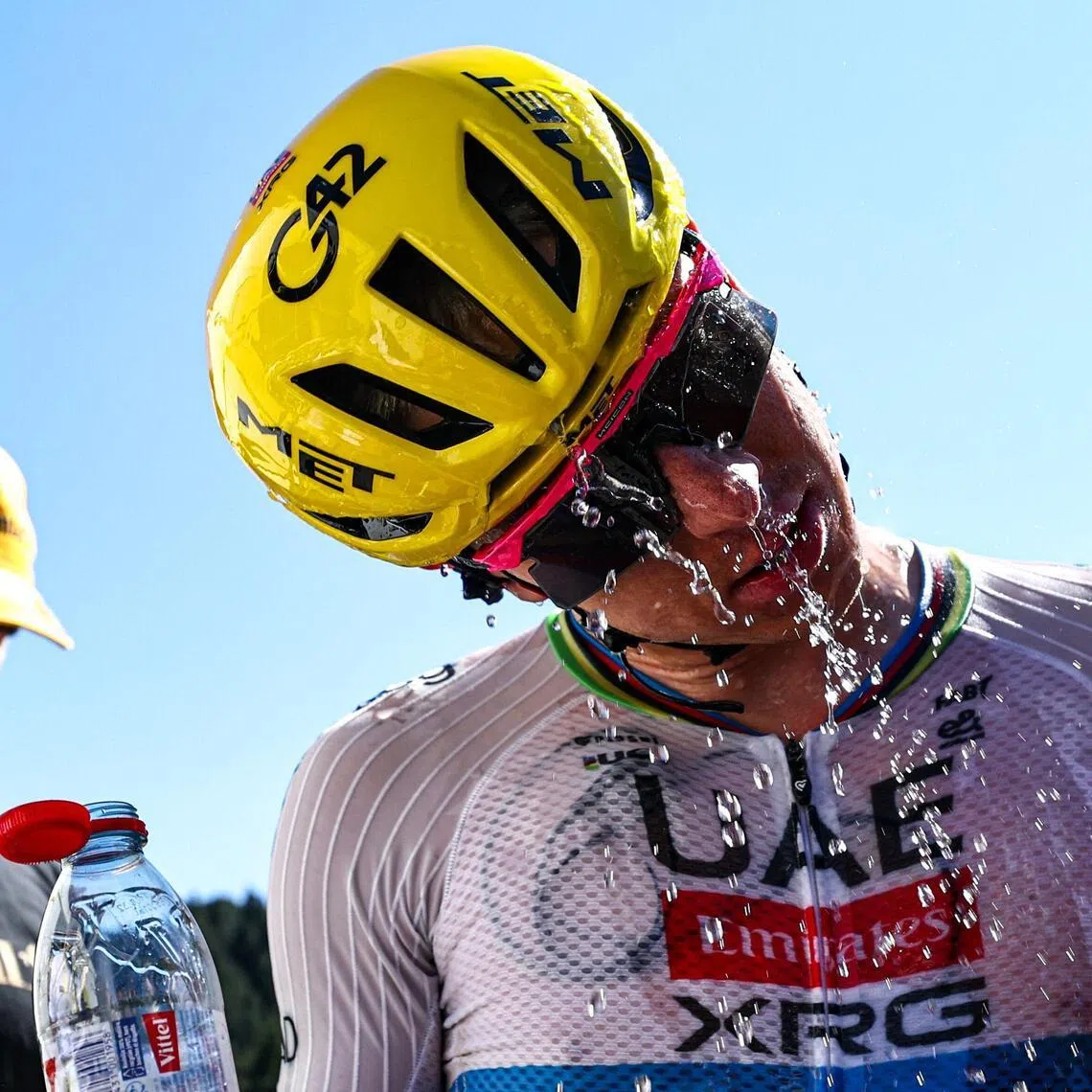 UAE Team Emirates - XRG's Slovenian rider Tadej Pogacar douses himself with water as he celebrates after winning the 3rd stage of the 113th edition of the Tour de France cycling race, 196 km between Granollers and Les Angles in southern France, on July 6, 2026. (Photo by Anne-Christine POUJOULAT / POOL / AFP)