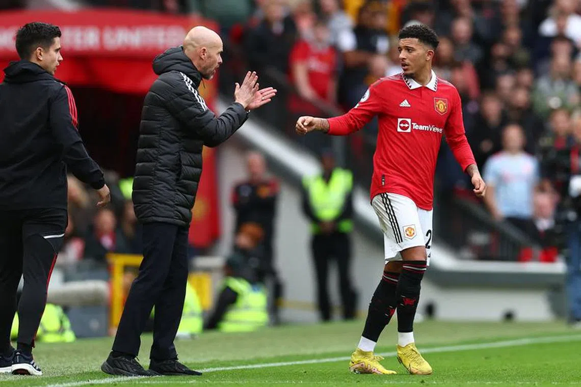 Soccer Football - Premier League - Manchester United v Newcastle United - Old Trafford, Manchester, Britain - October 16, 2022 Manchester United manager Erik ten Hag talks to Jadon Sancho REUTERS/David Klein/File photo