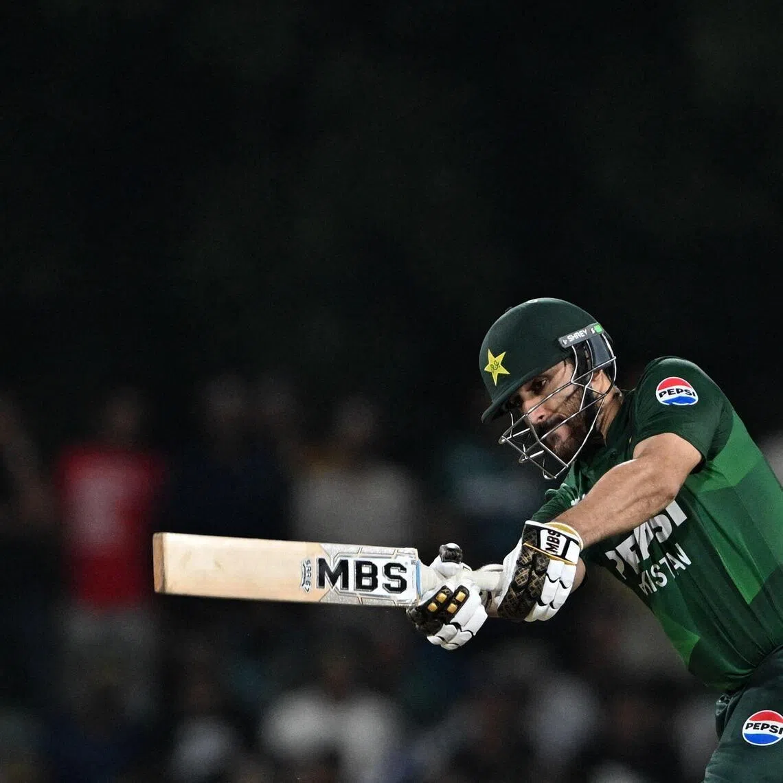 Pakistan's captain Salman Agha plays a shot in the third and final Twenty20 international cricket match against Sri Lanka at the Rangiri Dambulla International Stadium in Dambulla on Jan 11, 2026.