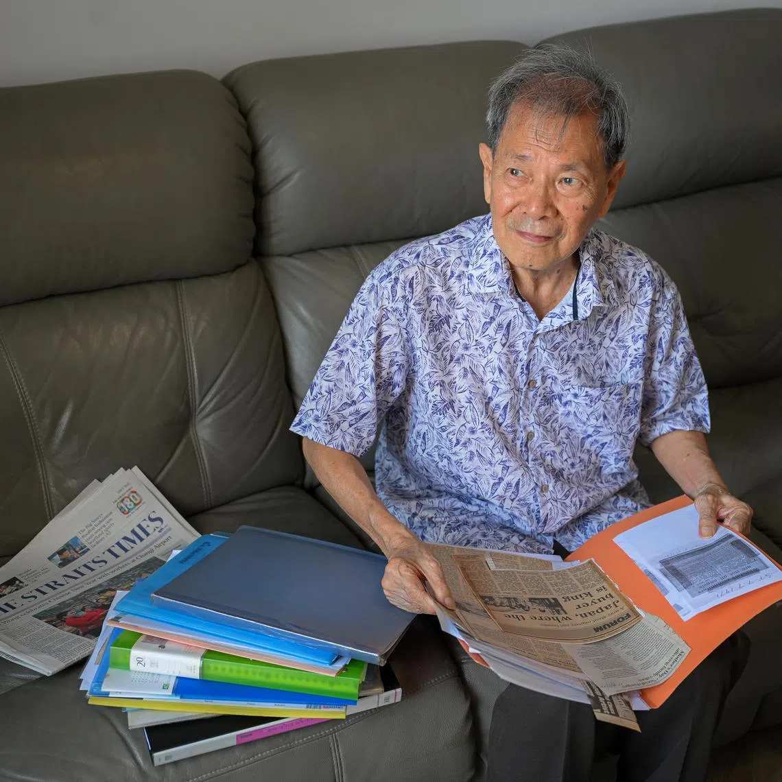 Mr Jeffrey Law Lee Beng at home with newspaper clippings from his contributions to the ST Forum page.