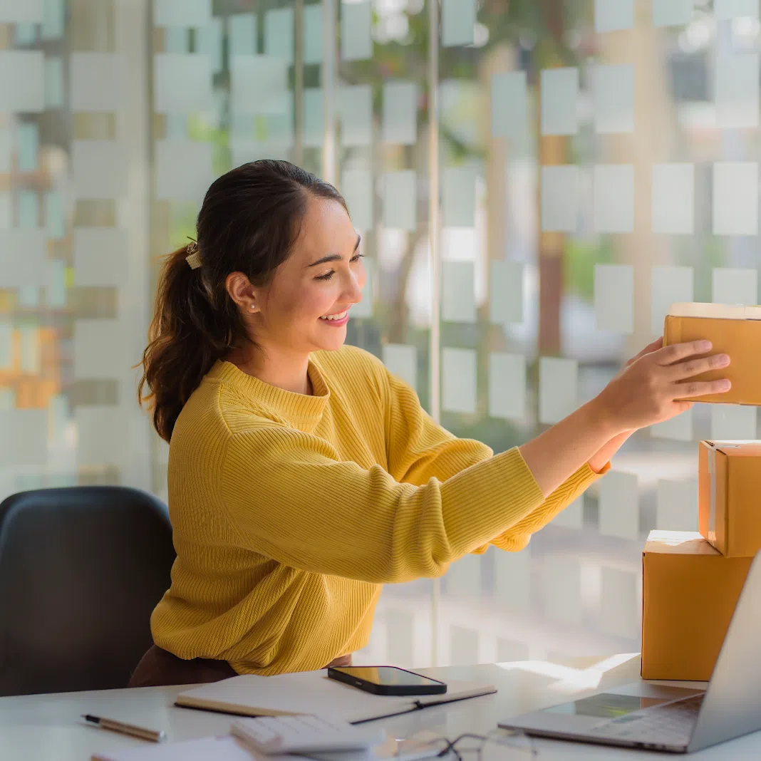 Shopee seller packing her boxes