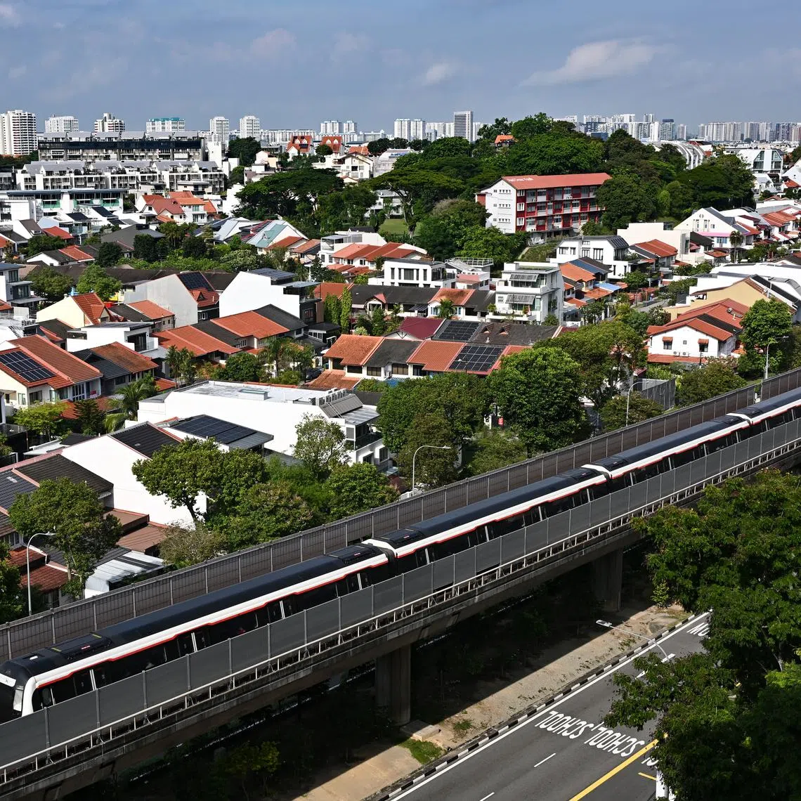 ST20240717-202474400151-Lim Yaohui-pixgeneric/ Generic photograph of private residential houses in Opera Estate with MRT train travelling between Bedok and Eunos MRT stations as viewed from Blk 32 Chai Chee Avenue on July 17, 2024. Can be used for stories on budget, money, URA, property, land, housing, population, economy, development, money, income, transport, fare, and LTA. (ST PHOTO: LIM YAOHUI)