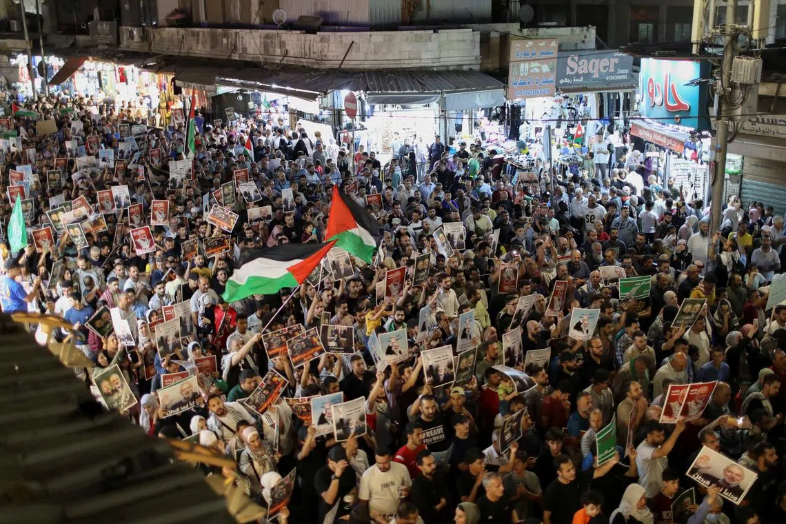 Demonstrators take part in a symbolic funeral for Hamas leader Ismail Haniyeh who was killed in Iran, in Amman, Jordan August 3, 2024. REUTERS/Alaa Al Sukhni/File Photo