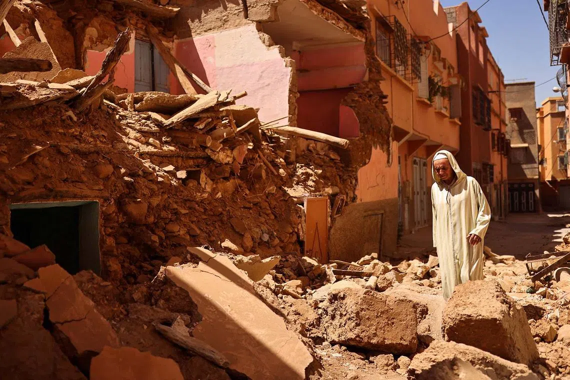 Mohamed Sebbagh, 66, stands in front of his destroyed house, in the aftermath of a deadly earthquake, in Amizmiz, Morocco, Sept 10.