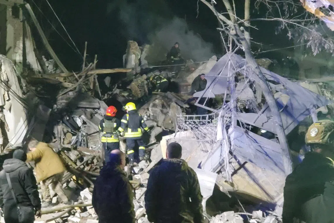 Rescuers work at a site of a residential building destroyed by a Russian missile strike, in Kramatorsk,  on Feb 1, 2023.