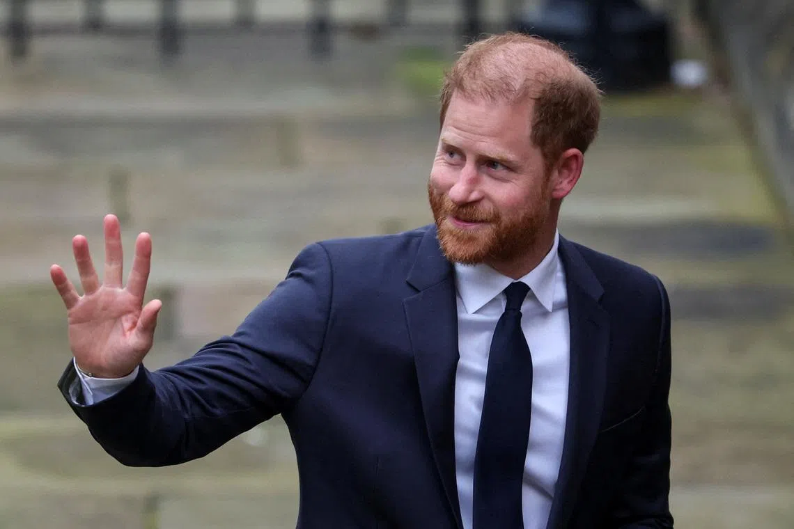 Britain's Prince Harry waves as he arrives to attend the start of the nine-week trial lawsuit against Associated Newspapers, publisher of the Daily Mail, which Britain's Prince Harry and others are suing over allegations of privacy breaches dating back 30 years, at the High Court in London, Britain, January 19, 2026. REUTERS/Isabel Infantes