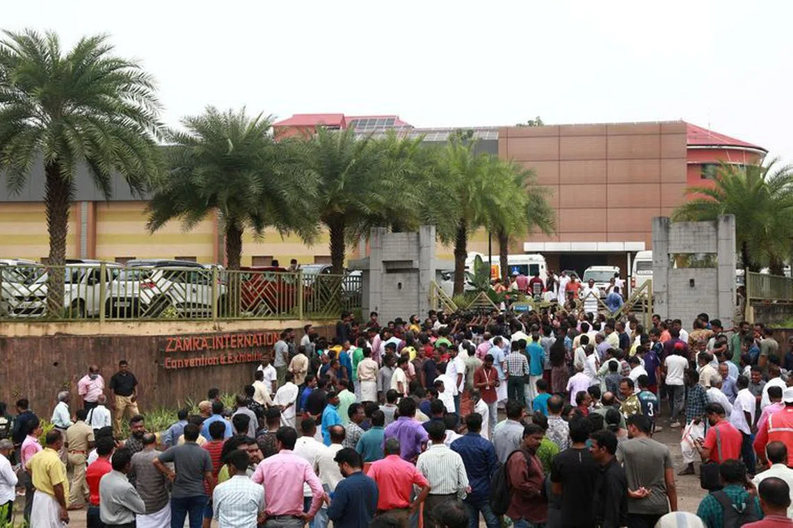 People stand outside the Zamra International Convention and Exhibition Centre where multiple blasts occurred during a religious gathering of Jehovah's Witnesses, a Christian group, in Kochi, India, October 29, 2023. REUTERS/Sivaram V/File photo