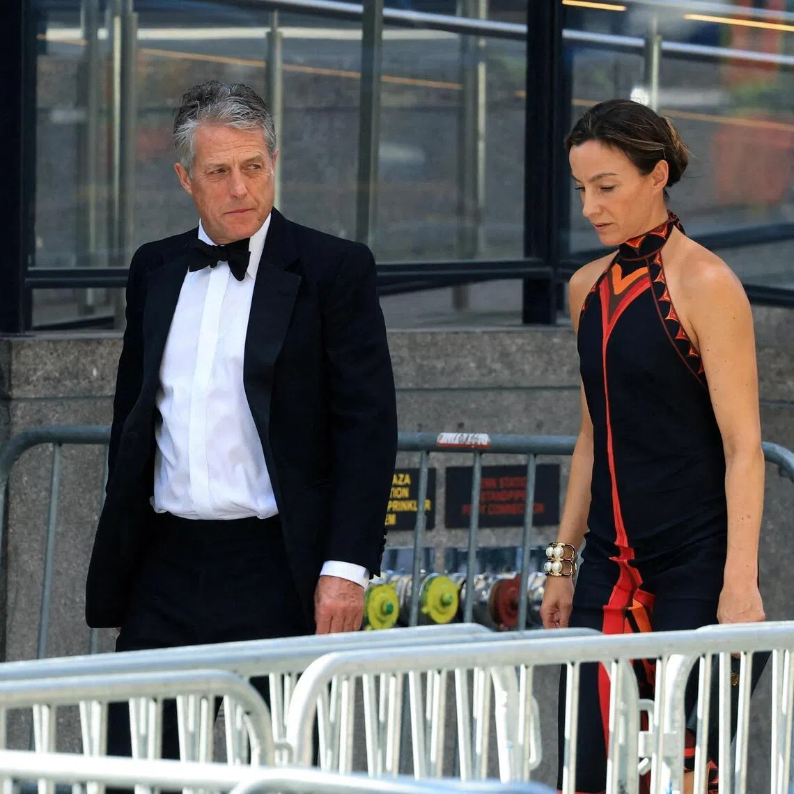 Hugh Grant with Anna Elisabet Eberstein arrive at Madison Square Garden, the venue for the reported wedding celebrations of singer Taylor Swift and National Football League (NFL) player Travis Kelce, in New York, U.S., July 3, 2026.  REUTERS/Brendan McDermid     TPX IMAGES OF THE DAY