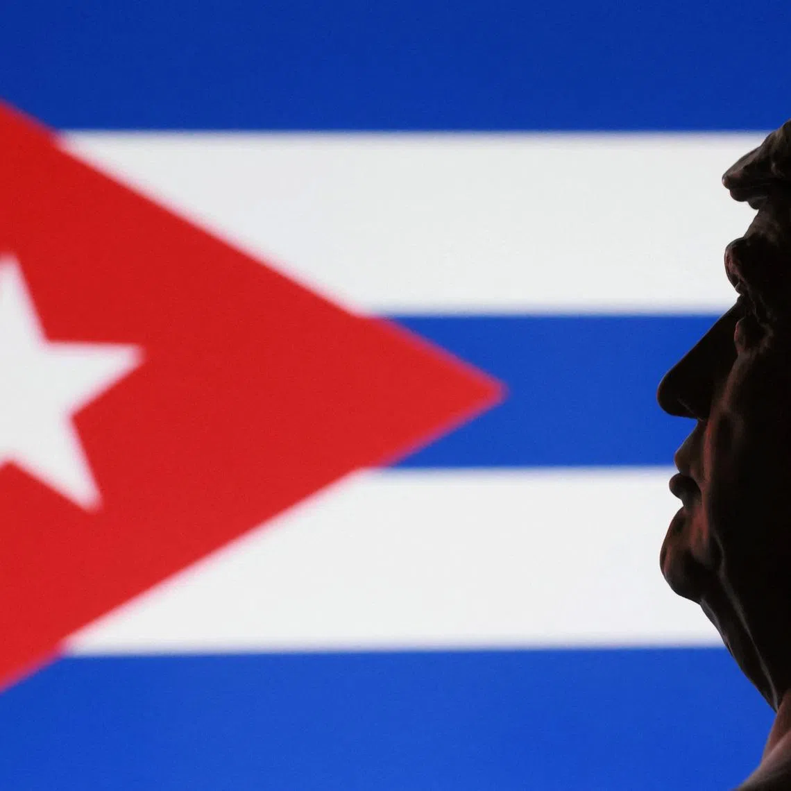 A 3D printed miniature of U.S. President Donald Trump and Cuban flag are seen in this illustration taken January 9, 2026. REUTERS/Dado Ruvic/Illustration