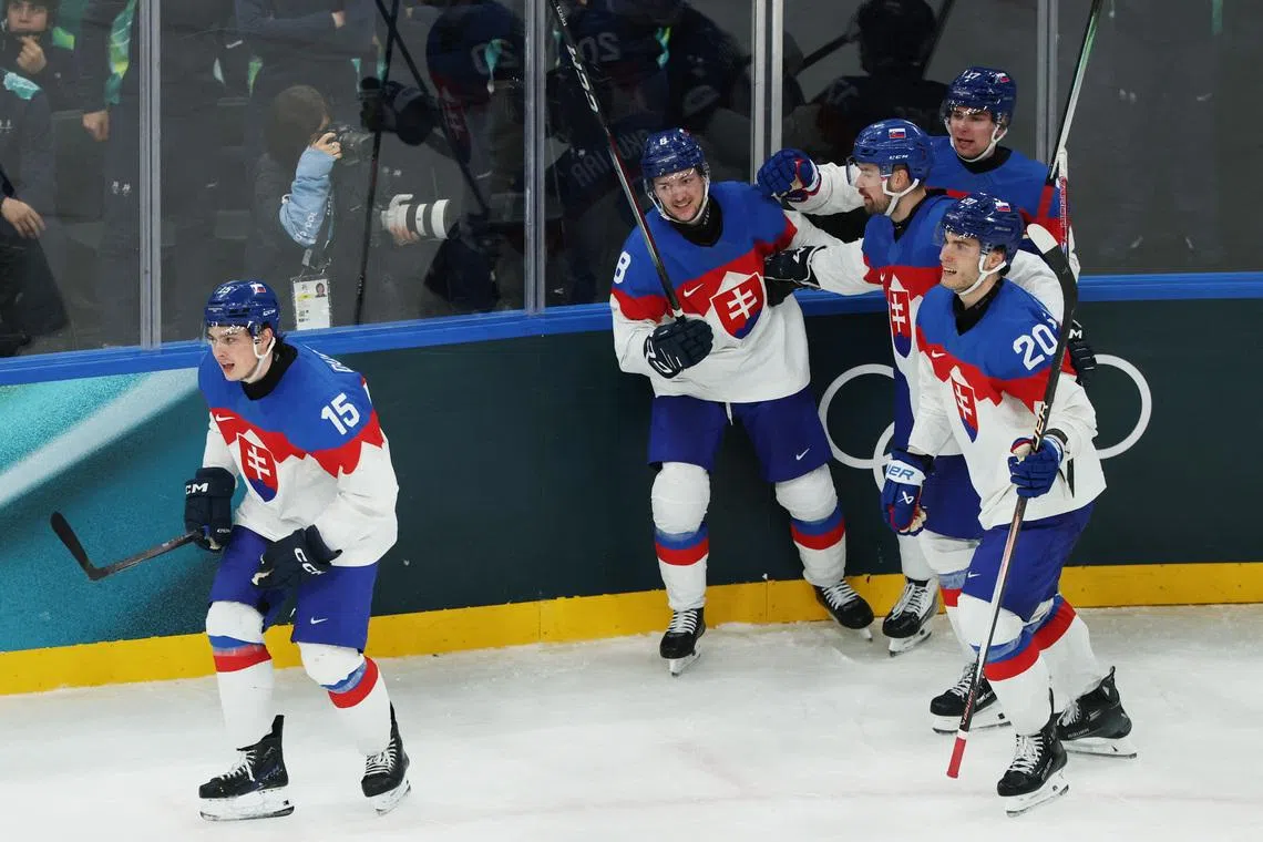 Milano Cortina 2026 Olympics - Ice Hockey - Men's Preliminary Round - Group B - Sweden vs Slovakia - Milano Santagiulia Ice Hockey Arena, Milan, Italy - February 14, 2026. Dalibor Dvorsky of Slovakia celebrates scoring their third goal with teammates REUTERS/Mike Segar