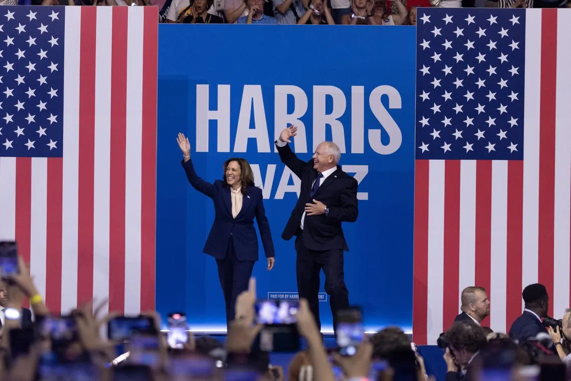US V-P Kamala Harris and Minnesota governor Tim Walz during a campaign rally at Temple University in Philadelphia, Pennsylvania, on Aug 6.