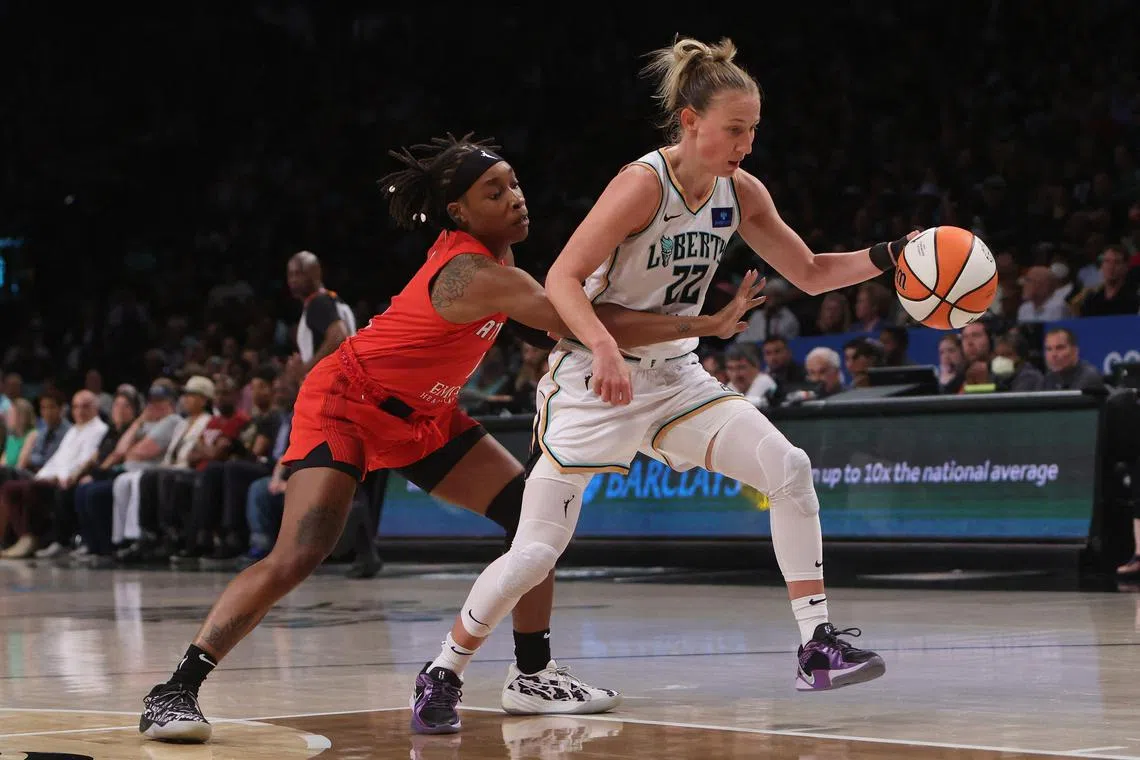 Jordin Canada of the Atlanta Dream attempts to stop Courtney Vandersloot of the New York Liberty at Barclays Centre on Sept 19, 2024.