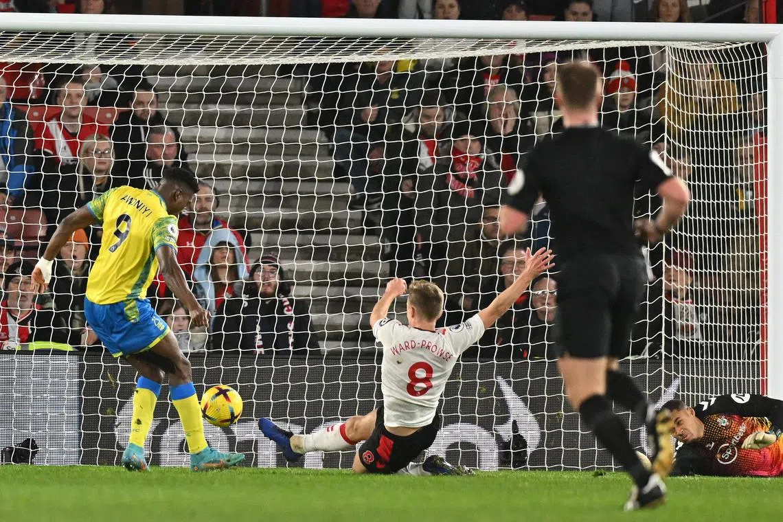 Nottingham Forest's Nigerian striker Taiwo Awoniyi scores the winning goal.