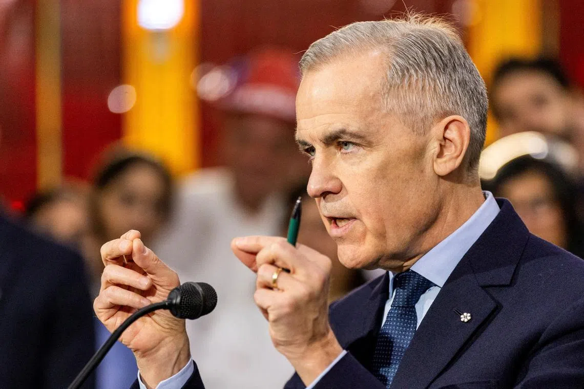 FILE PHOTO: Canada's Prime Minister Mark Carney speaks to the media after touring auto parts manufacturer Martinrea Industries in Woodbridge, Ontario, Canada, February 5, 2026. REUTERS/Carlos Osorio/File Photo