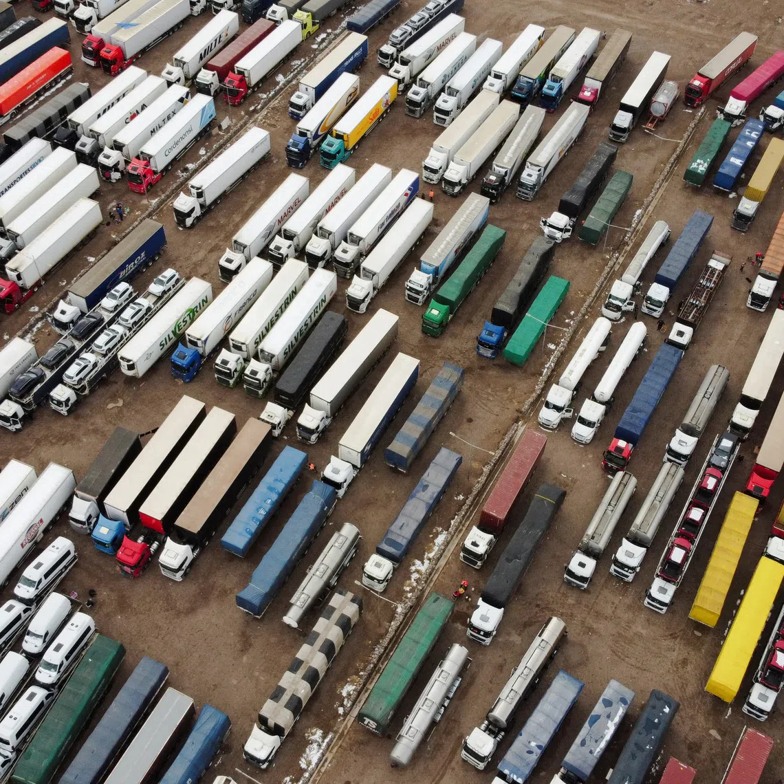 FILE PHOTO: A drone view shows parked trucks as truckers wait for the Cristo Redentor border crossing between Argentina and Chile to reopen after heavy snowfall forced its closure, in Uspallata, Mendoza province, Argentina, July 22, 2026. REUTERS/Maximiliano Rios/File Photo