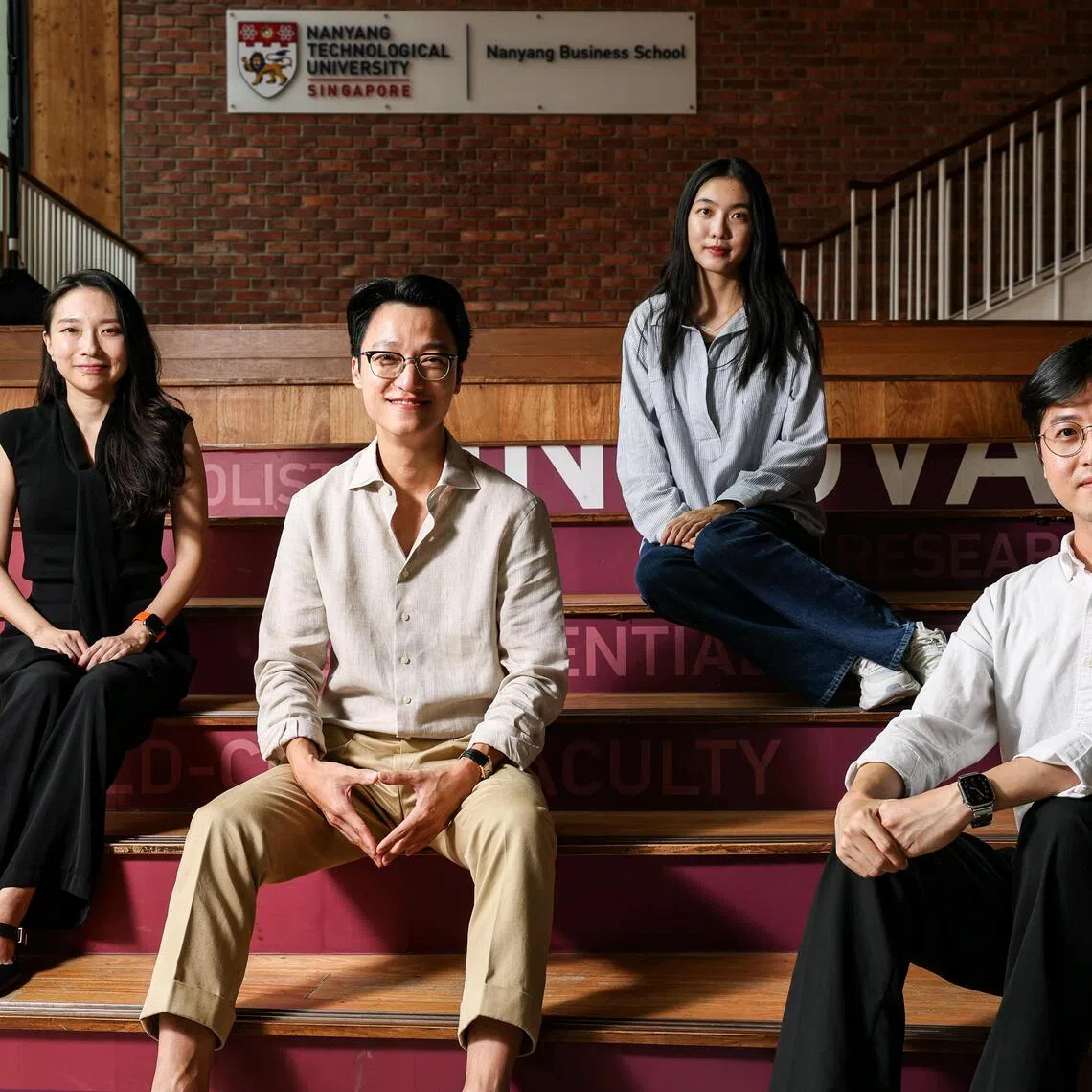 Profile of Hyeokkoo Eric Kwon (second from left), 36, provost?s chair professor in Information Systems at Nanyang Business School (NBS), Nanyang Technological University (NTU), with his team comprising Jaecheol Park (right), 36, assistant professor in the Division of Information Technology and Operations Management at NBS; PhD student Mo Jiayun (third from left), 23; and PhD candidate Kayoung Shin (left), 39, at Nanyang Business School on Sept 1, 2026. The team is one of 14 worldwide to recently receive funding from OpenAI, as part of the technology firm?s efforts to promote economic opportunity and societal resilience as AI advances. The researchers are developing an AI system that can predict how people might respond to government policies, such as cash handouts, before they are implemented. The system uses real spending data from 1.5 million South Koreans to create anonymised profiles that cannot be traced back to individuals. ST PHOTO: BRIAN TEO