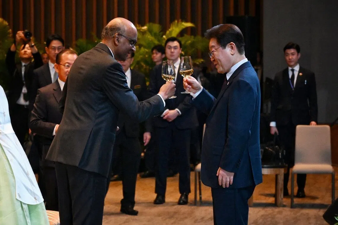 President Tharman Shanmugaratnam (left) proposing a toast to visiting South Korean President Lee Jae Myung during the state banquet on March 2.