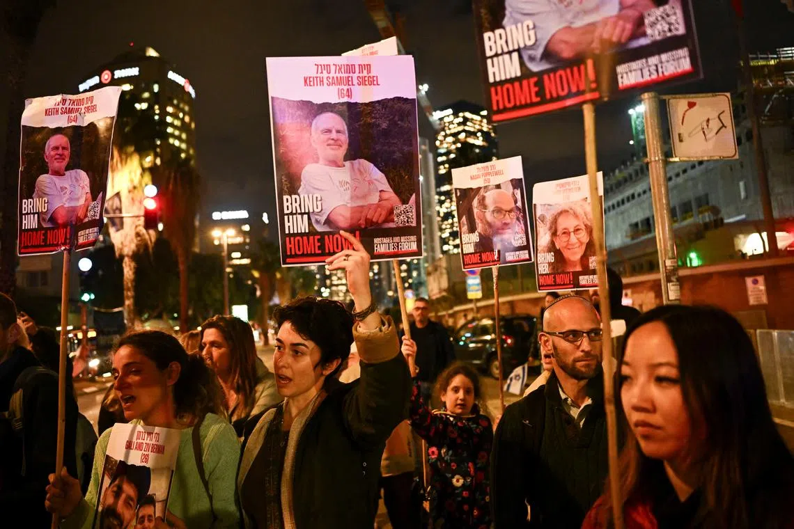 Demonstrators attend a rally calling for the release of hostages kidnapped in the deadly October 7 attack on Israel by the Palestinian Islamist group Hamas from Gaza, in Tel Aviv, Israel, February 20, 2024. REUTERS/Dylan Martinez