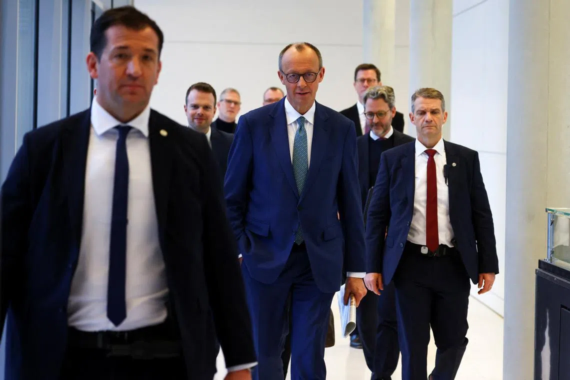 Christian Democratic Party (CDU) party leader Friedrich Merz walks on the day of a fraction meeting at the Reichstag building in Berlin, Germany, January 28, 2025. REUTERS/Nadja Wohlleben