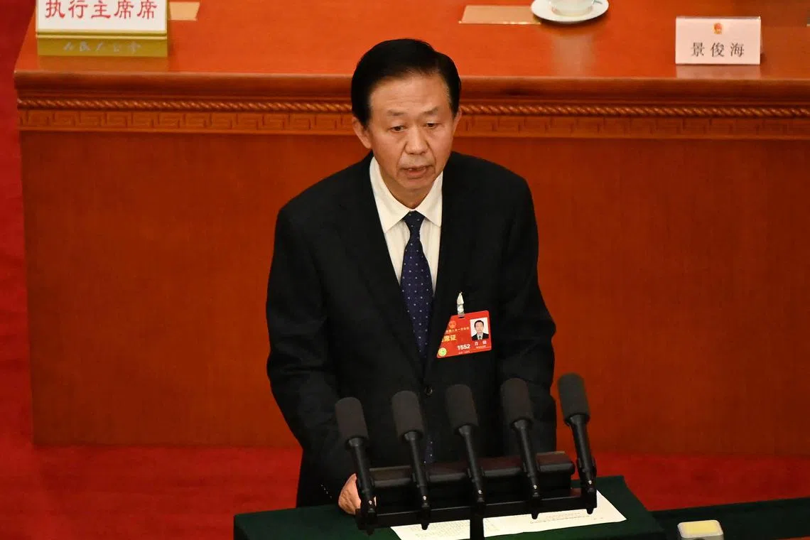 State Councilor and Secretary-General of the State Council Xiao Jie speaks during the second plenary session of the National People's Congress (NPC) at the Great Hall of the People in Beijing on March 7, 2023. (Photo by Greg Baker / AFP)