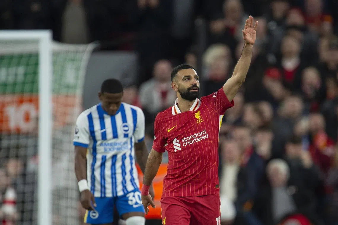Liverpool forward Mohamed Salah celebrates after scoring the second goal in the 2-1 win over Brighton & Hove Albion.