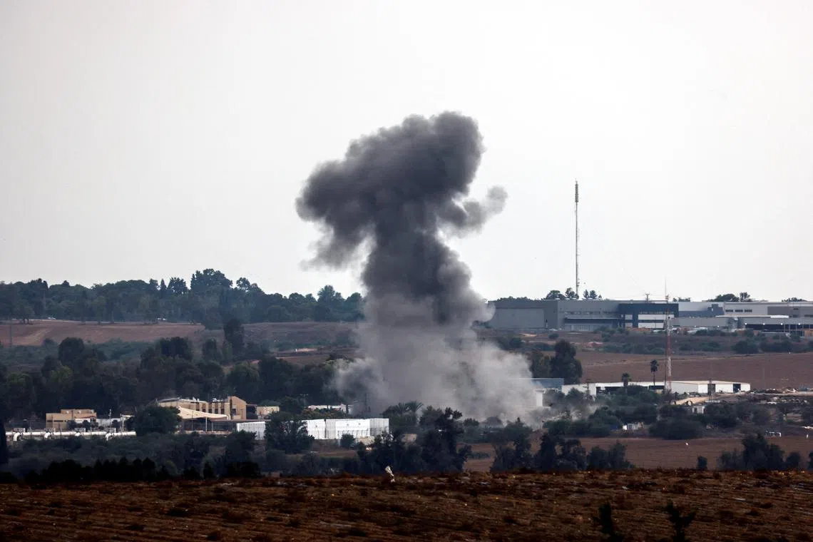 A rocket launched from the Gaza Strip strikes an area near Sderot, southern Israel, on Oct 9.
