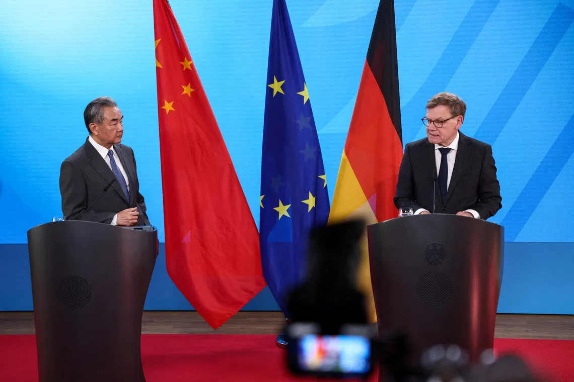FILE PHOTO: German Foreign Minister Johann Wadephul and Chinese Foreign Minister Wang Yi attend a press conference in Berlin, Germany July 3, 2025. REUTERS/Nadja Wohlleben/File Photo