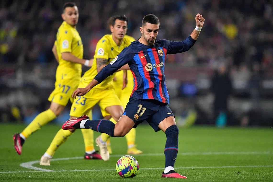 Barcelona forward Ferran Torres taking a shot during the match against Cadiz at the Camp Nou stadium in Barcelona.