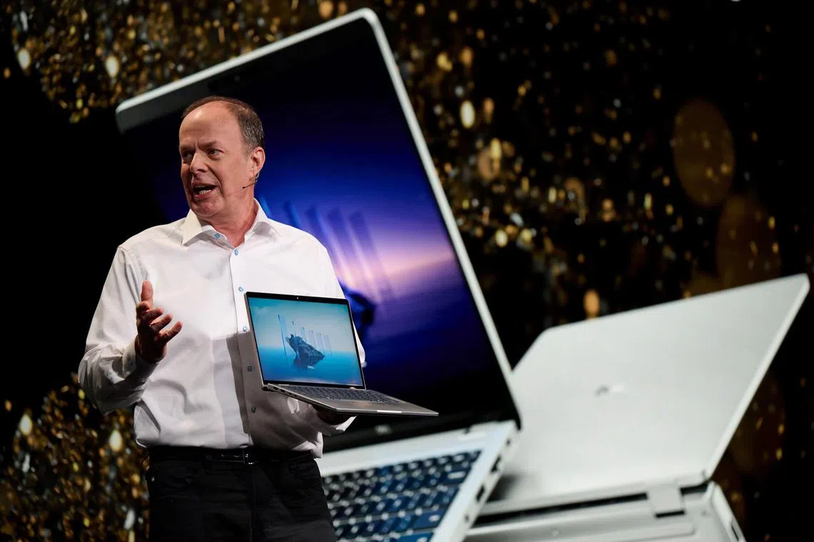 Sam Burd, president of client solutions at Dell Technologies., holds a Dell Pro laptop computer during the CES event in Las Vegas on Jan. 6, 2025. 