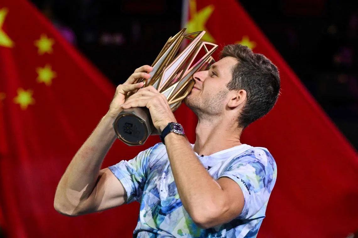 Hubert Hurkacz celebrating with the winner's trophy after defeating Andrey Rublev at the Shanghai Masters tennis tournament on Oct 15.