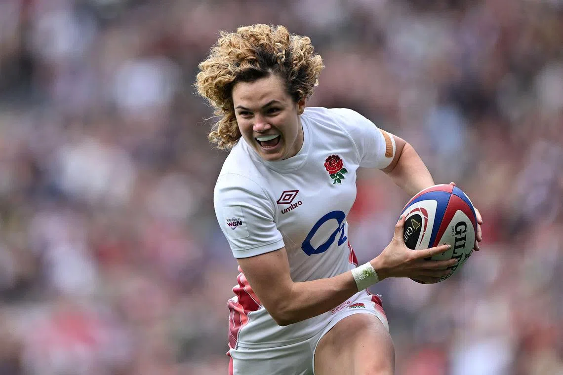 England full-back Ellie Kildunne celebrates after scoring a try during the Six Nations union match against Ireland at Twickenham on April 20, 2024.