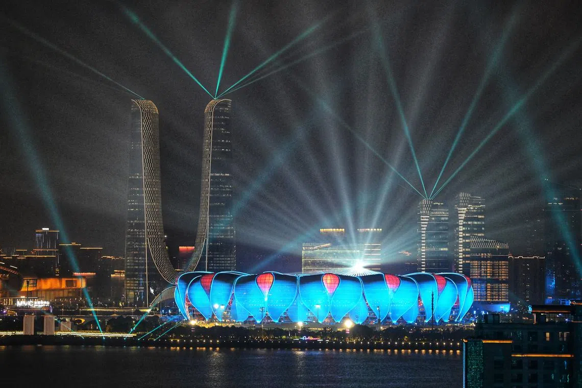 Light beams radiating from the Hangzhou Olympic Sports Center stadium during the grand finale of opening ceremony of the 19th Asian Games Hangzhou 2022 on Sept 23.