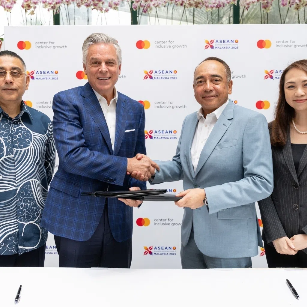 Vice chairman and president of Mastercard Strategic Growth Jon Huntsman (second from left) and chairman of Asean Business Advisory Council Malaysia Tan Sri Nazir Razak (second from right) at the signing ceremony to host the Mastercard Asean Inclusive Growth Summit across South-east Asia over the next three years.
