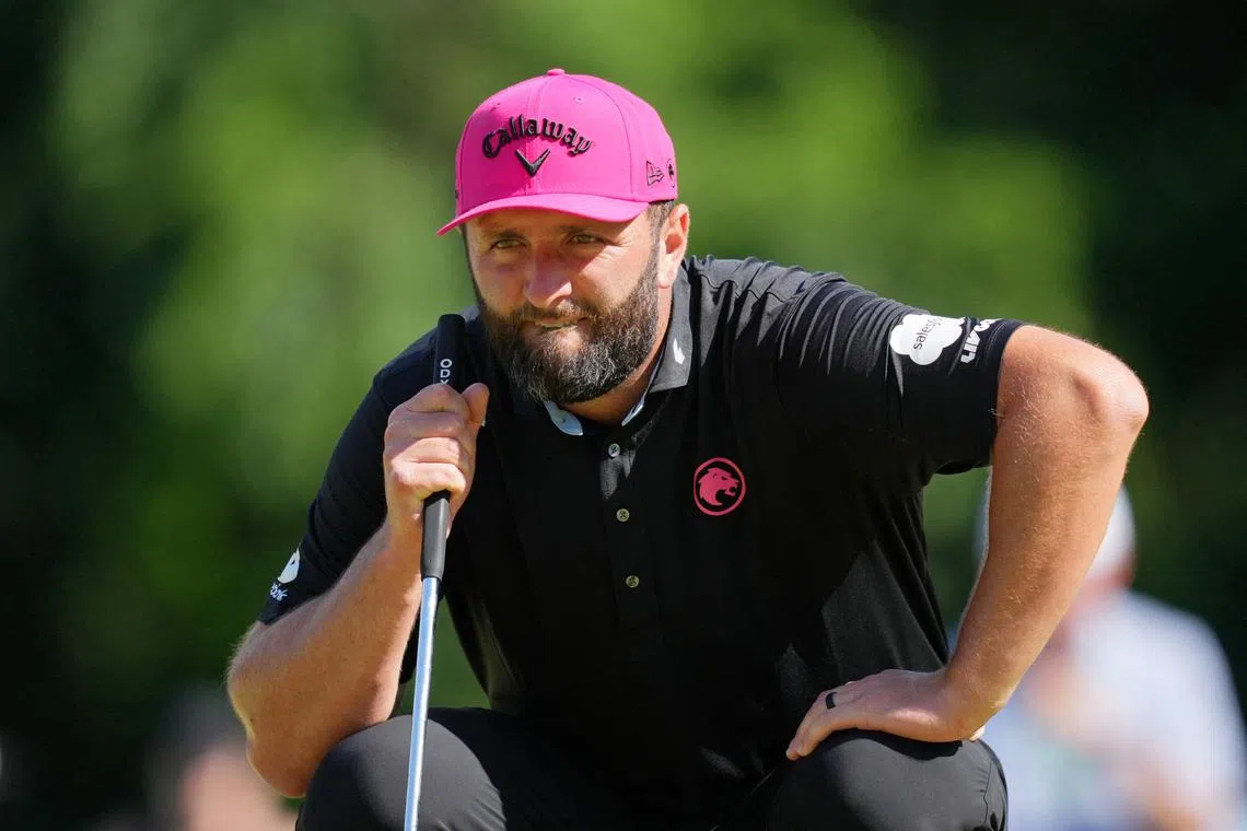 May 18, 2025; Charlotte, North Carolina, USA; Jon Rahm lines up a putt on the 11th green during the final round of the PGA Championship golf tournament at Quail Hollow. Mandatory Credit: Aaron Doster-Imagn Images